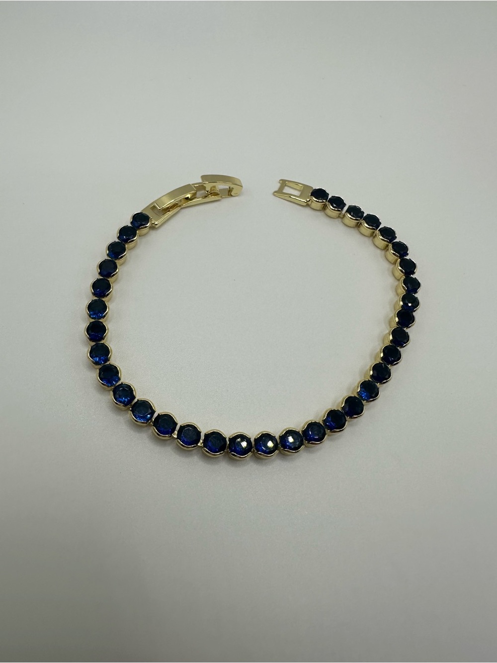 Gold-Plated Tennis Bracelet with Deep Blue Stones